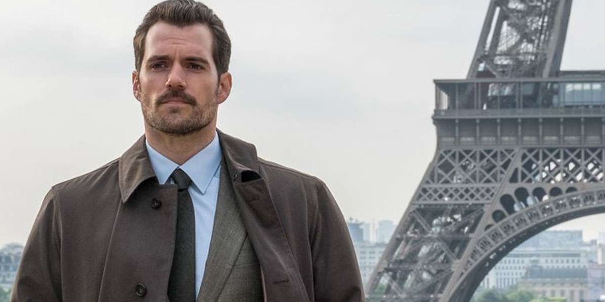 August Walker walking away from Erica Sloane with the Eiffel Tower in the background