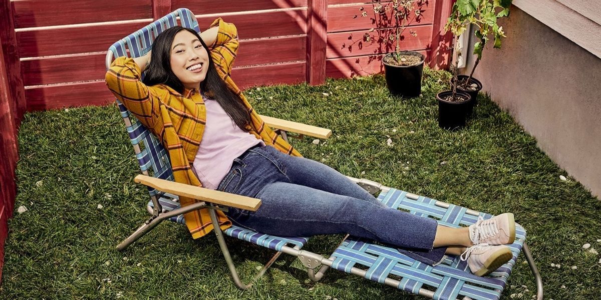 Awkwafina on a lawn chair
