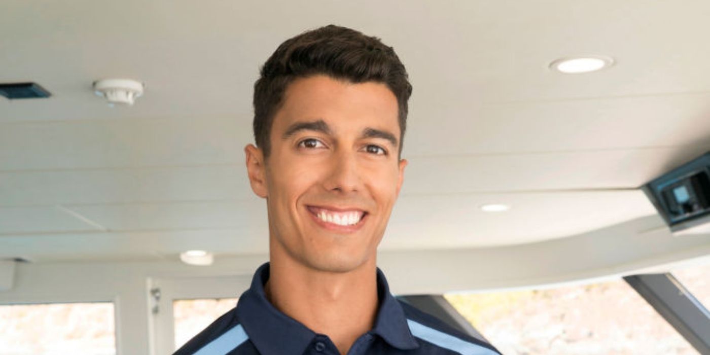 Bruno Duarte Below Deck season 5 cast photo smiling in a navy blue t shirt