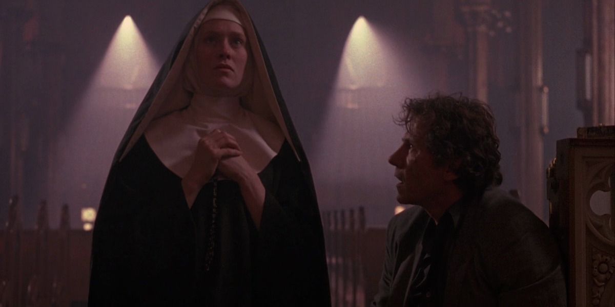 Harvey Keitel kneels by the side of a praying nun in Bad Lieutenant