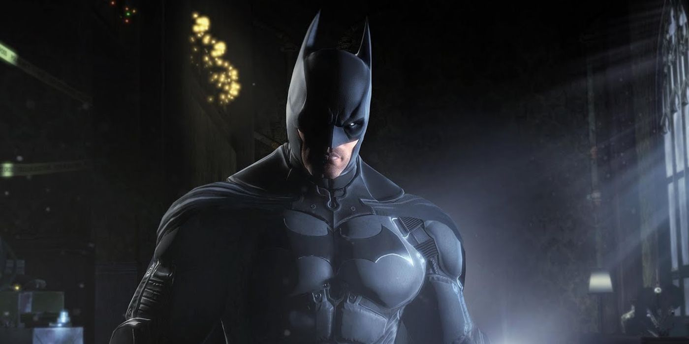 An image of Batman standing in a warehouse in Batman Arkham Origins