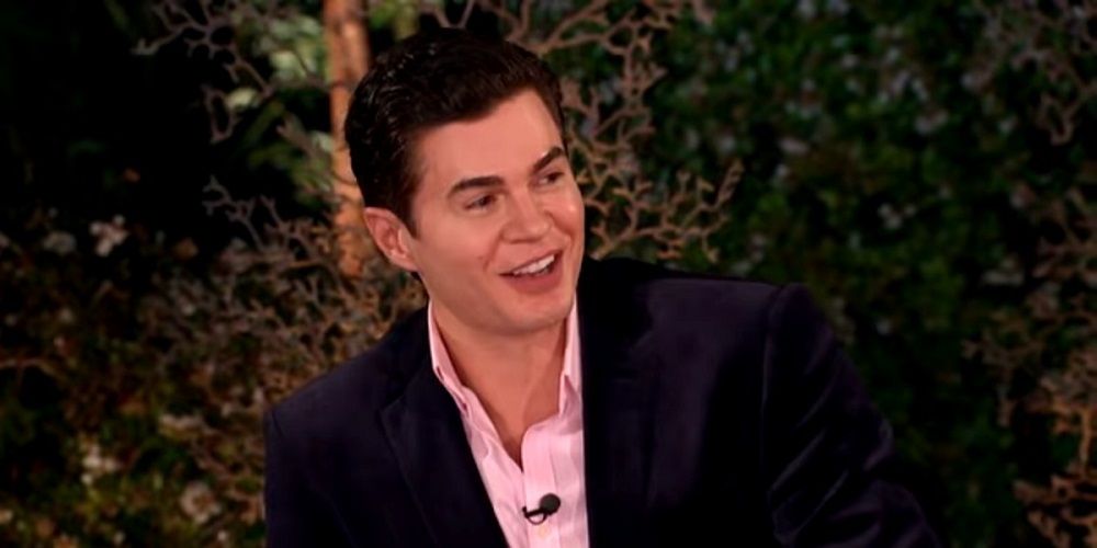 Dr. Will Kirby from Big Brother smiling in an interview