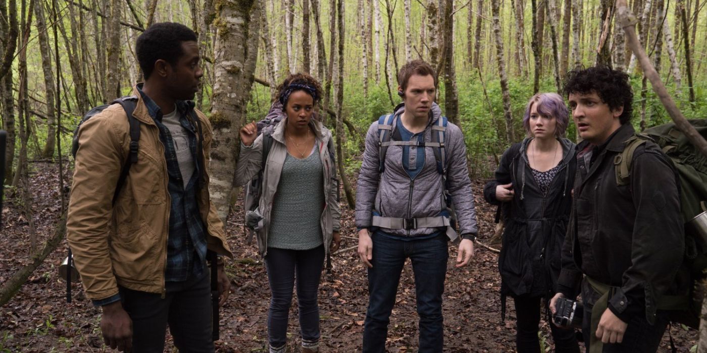 The main characters of Blair Witch standing in the woods.