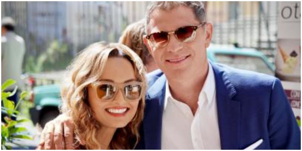 Bobby Flay and Giada DiLaurentis embracing in Italy in an episode of 'Bobby and Giada In Italy.'
