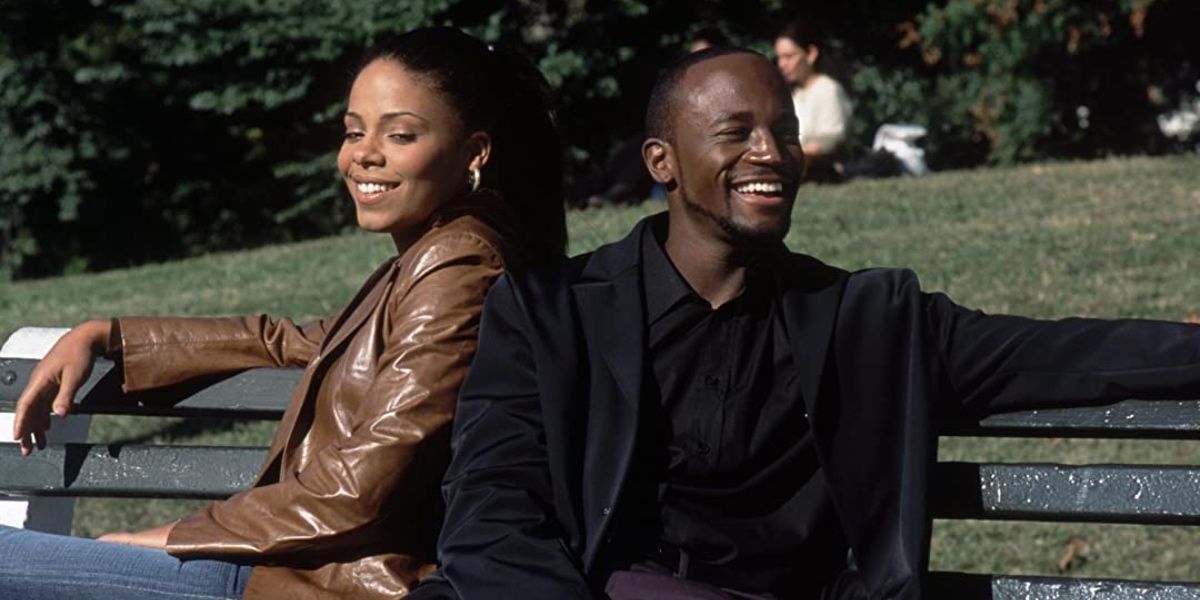 Sidney y Dre sentados en un banco del parque en Brown Sugar