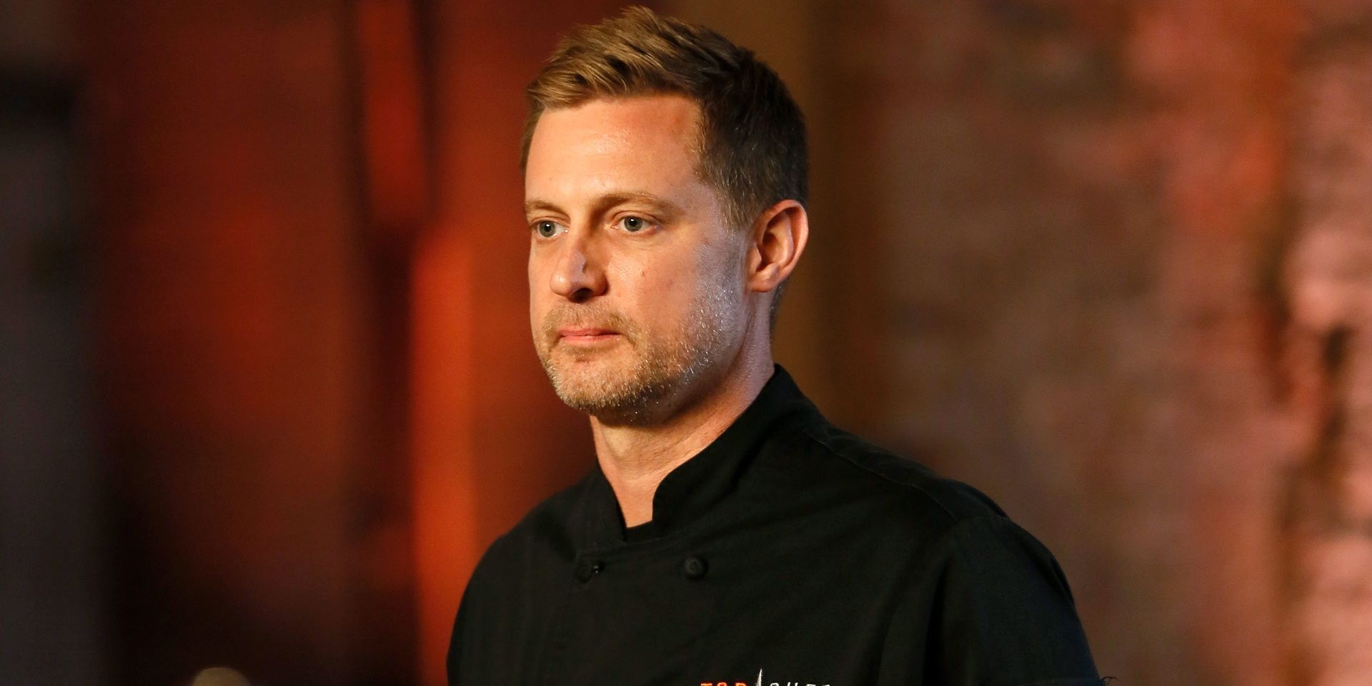 An image of Bryan Voltaggio looking off-camera pensively in Top Chef.