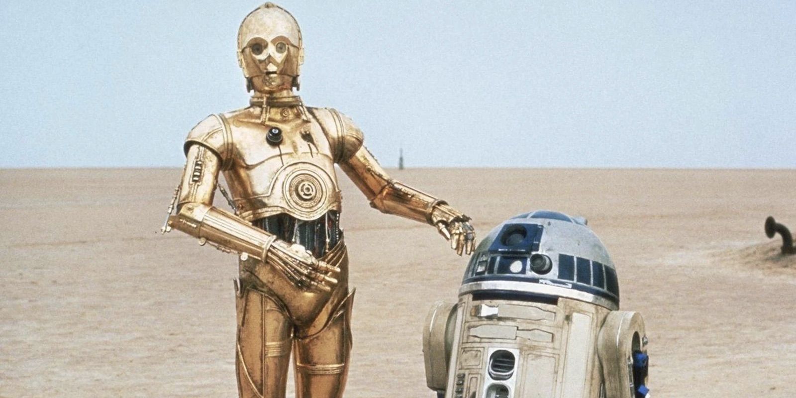 C-3PO and R2-D2 in the desert of Tatooine in Star Wars