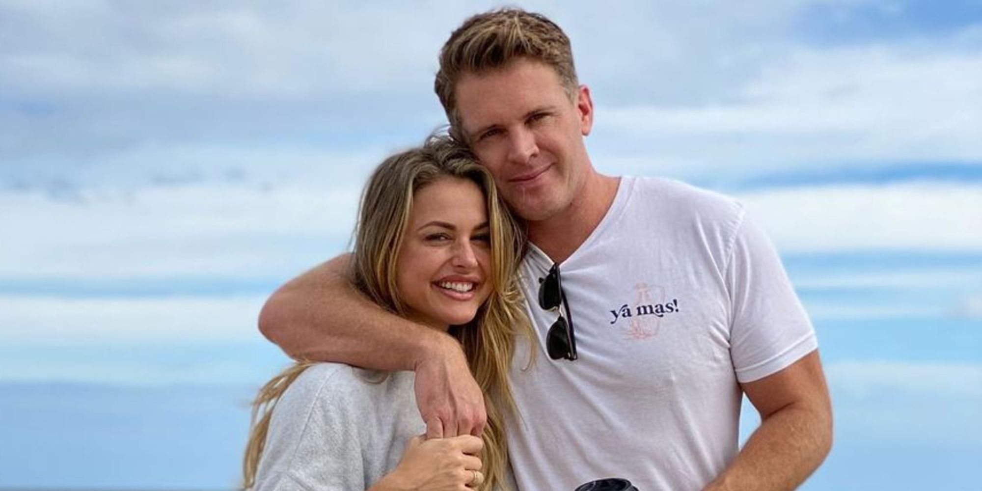 Christmas and Memphis from Big Brother smiling with his arm wrapped around her at the beach.