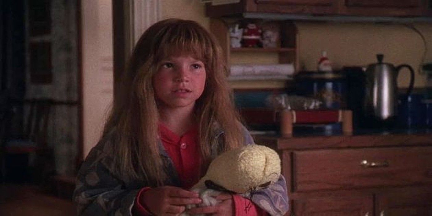 Ruby Sue holding a doll and talking to someone in National Lampoon's Christmas Vacation