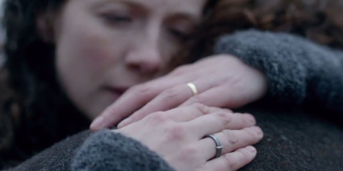 An image of Claire hugging Jamie in Outlander