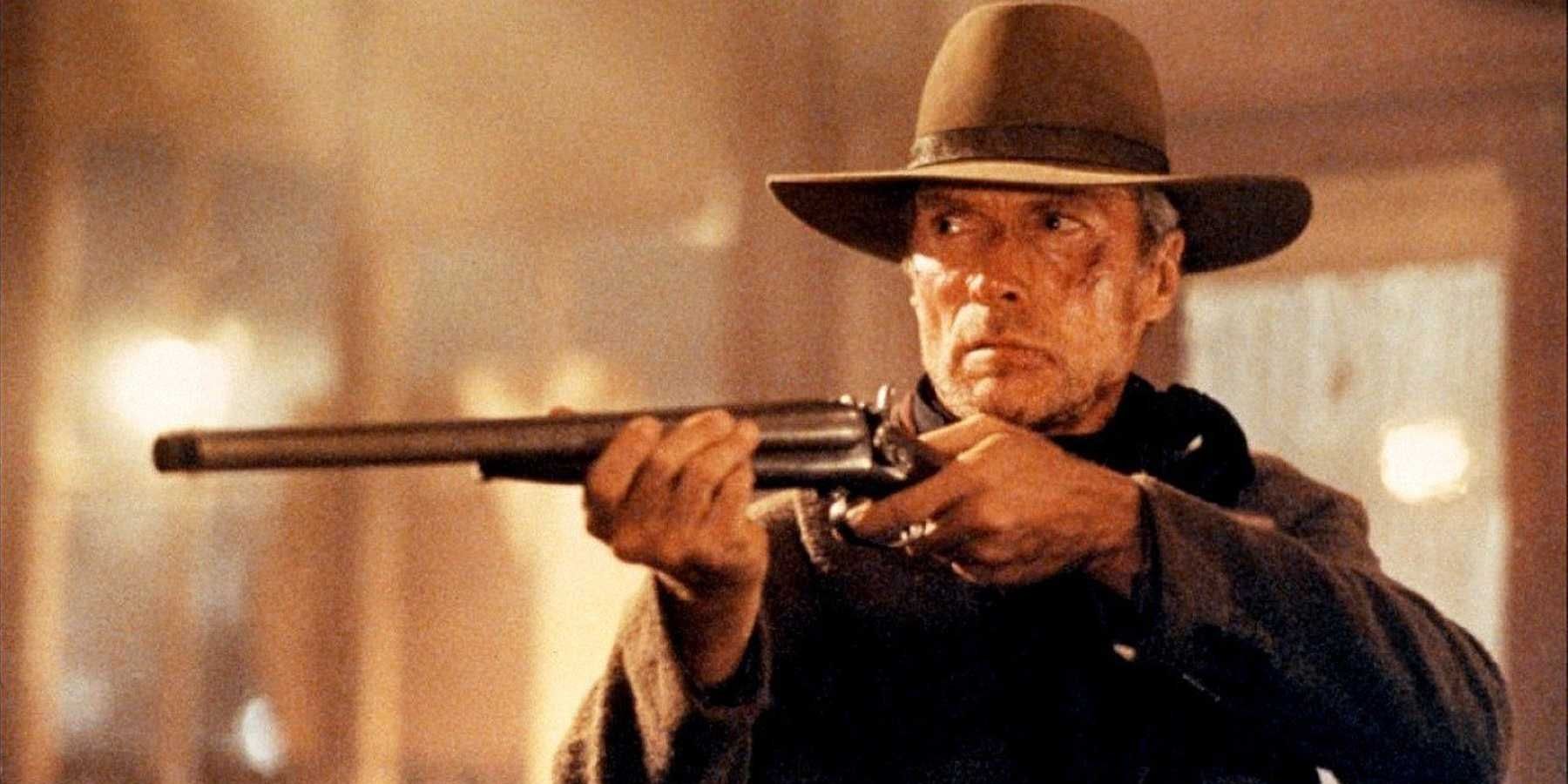 Clint Eastwood aiming his rifle in a saloon in Unforgiven