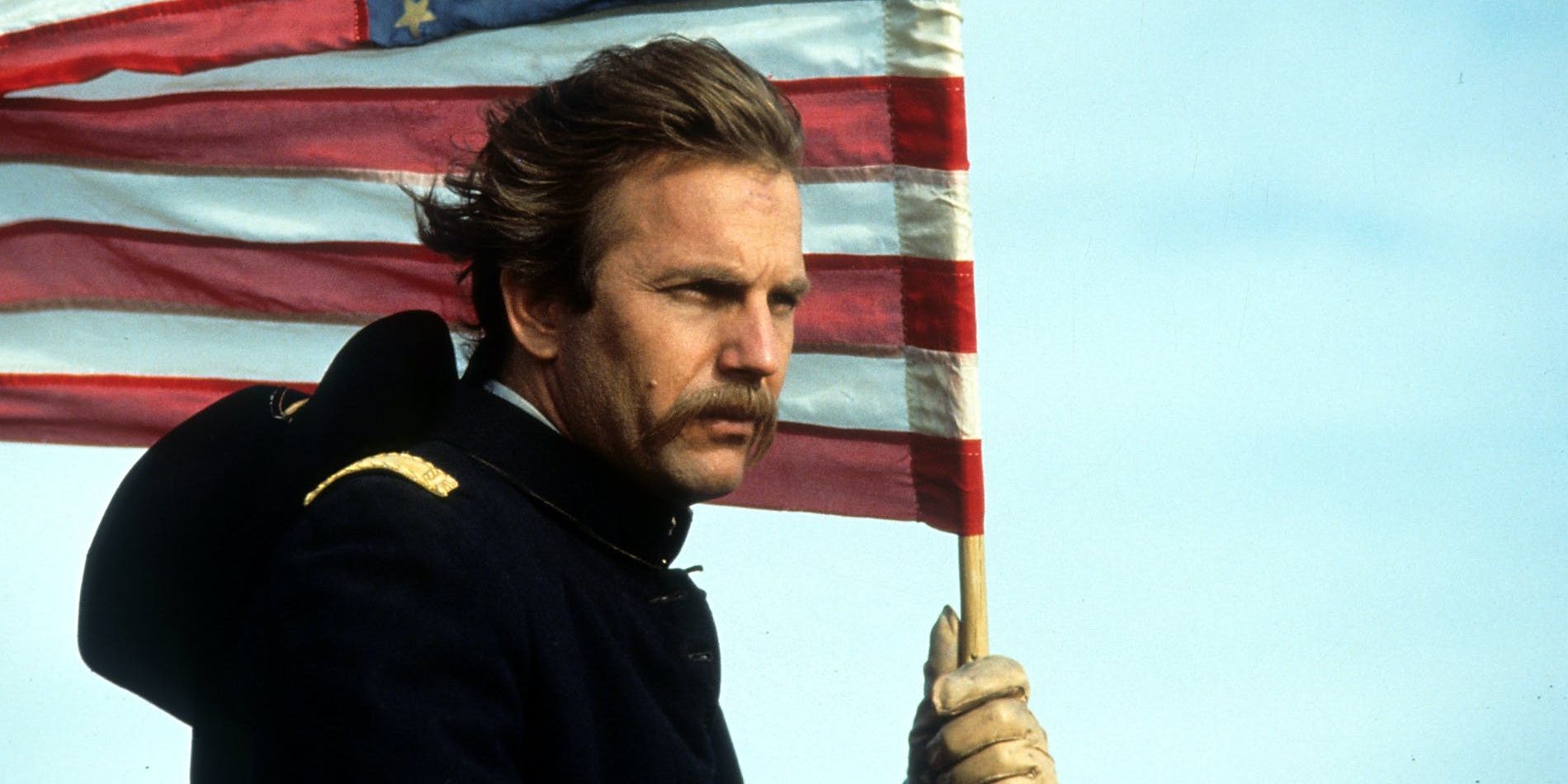 Kevin Costner holds an American flag in Dances with Wolves