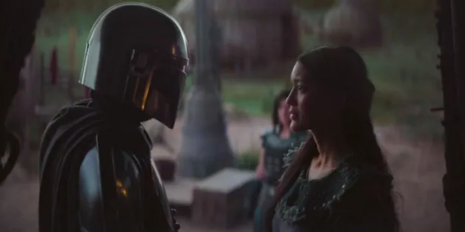 Din Djarin and Omera standing opposite each other in The Mandalorian