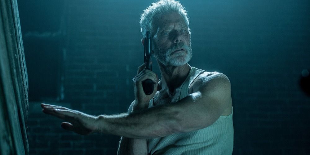 Blind man (Stephen Lang) with a gun in the dark Don't Breathe