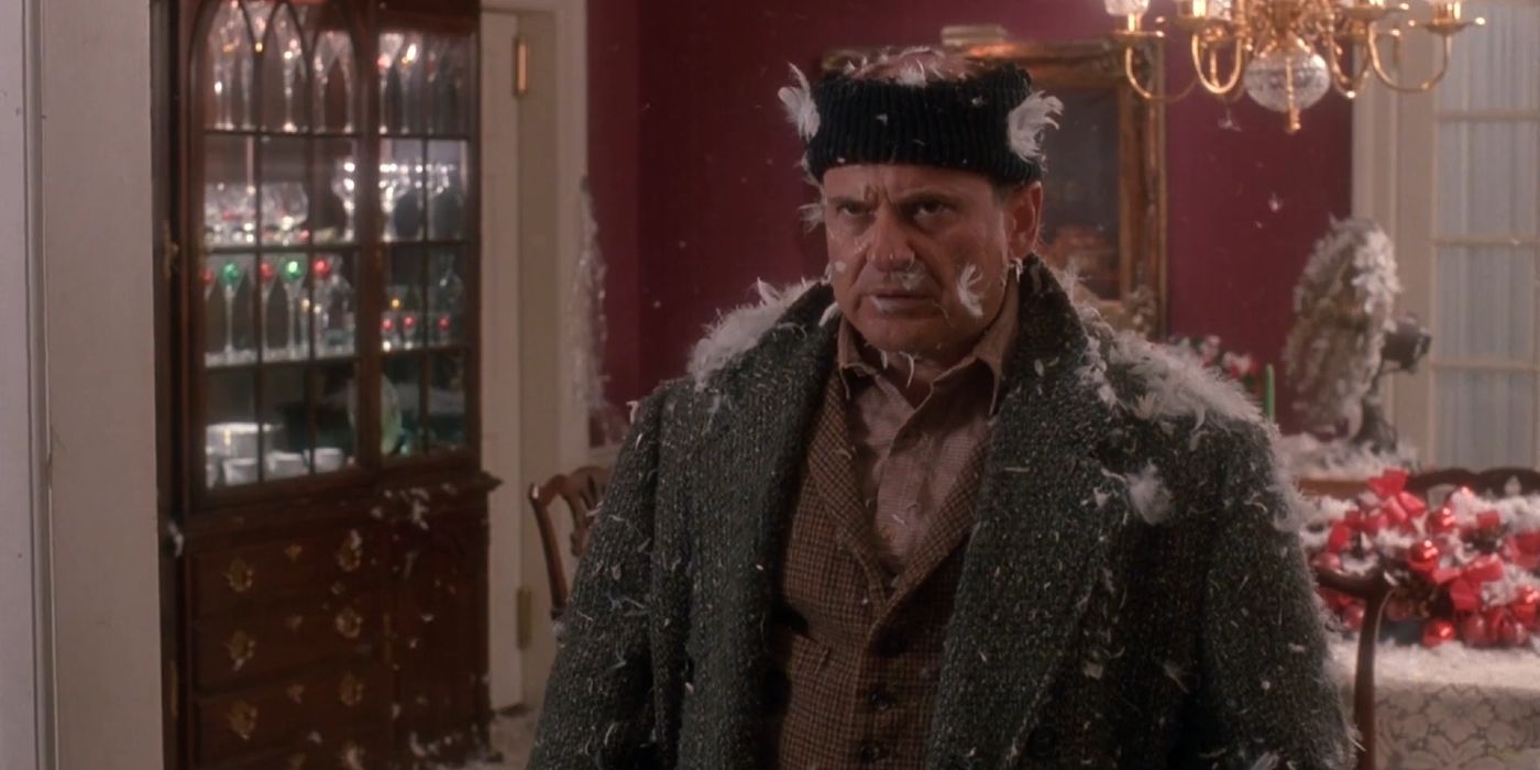 Harry glaring at Marv while covered in feathers in Home Alone (1990)