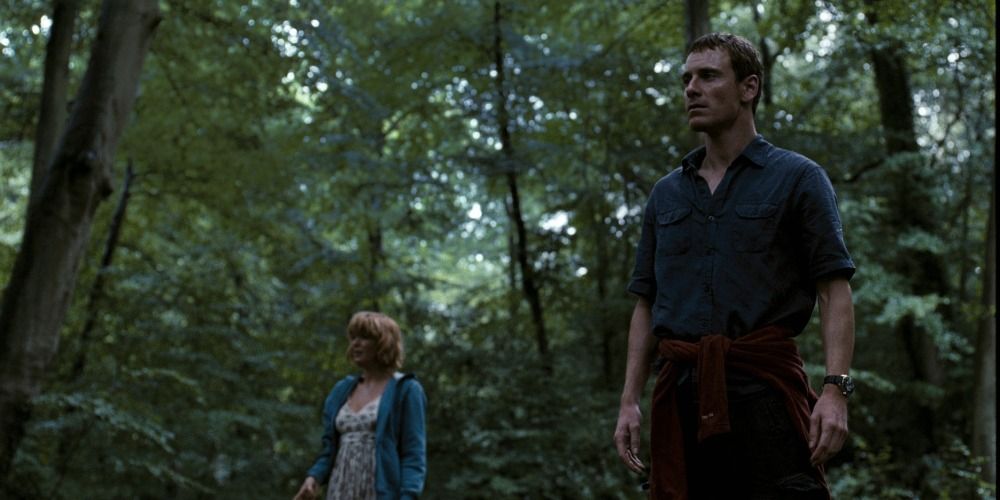 Cast stand in a forest looking off into the distance in Eden Lake (2008)