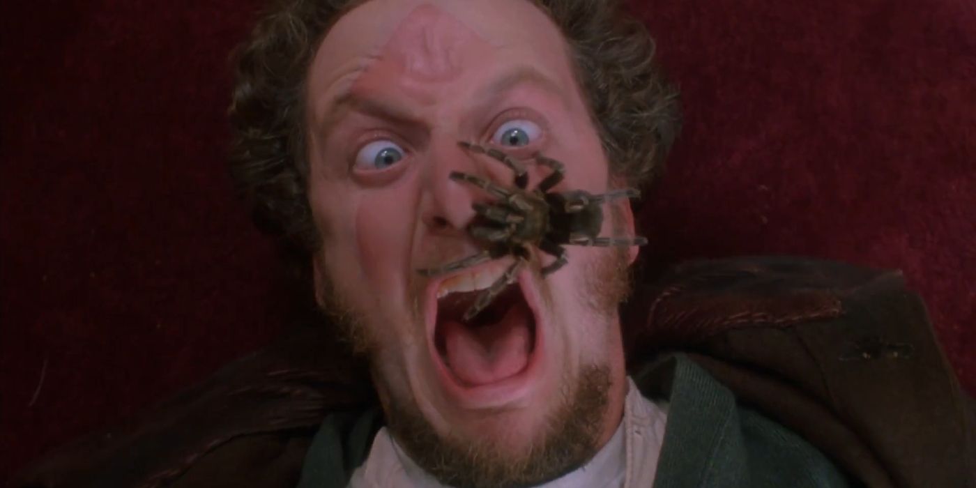 Marv screaming with a spider on his face in Home Alone (1990)