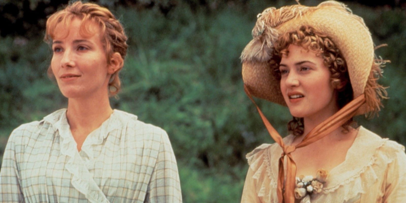 Emma Thompson and Rosamund Pike stand staring into the distance