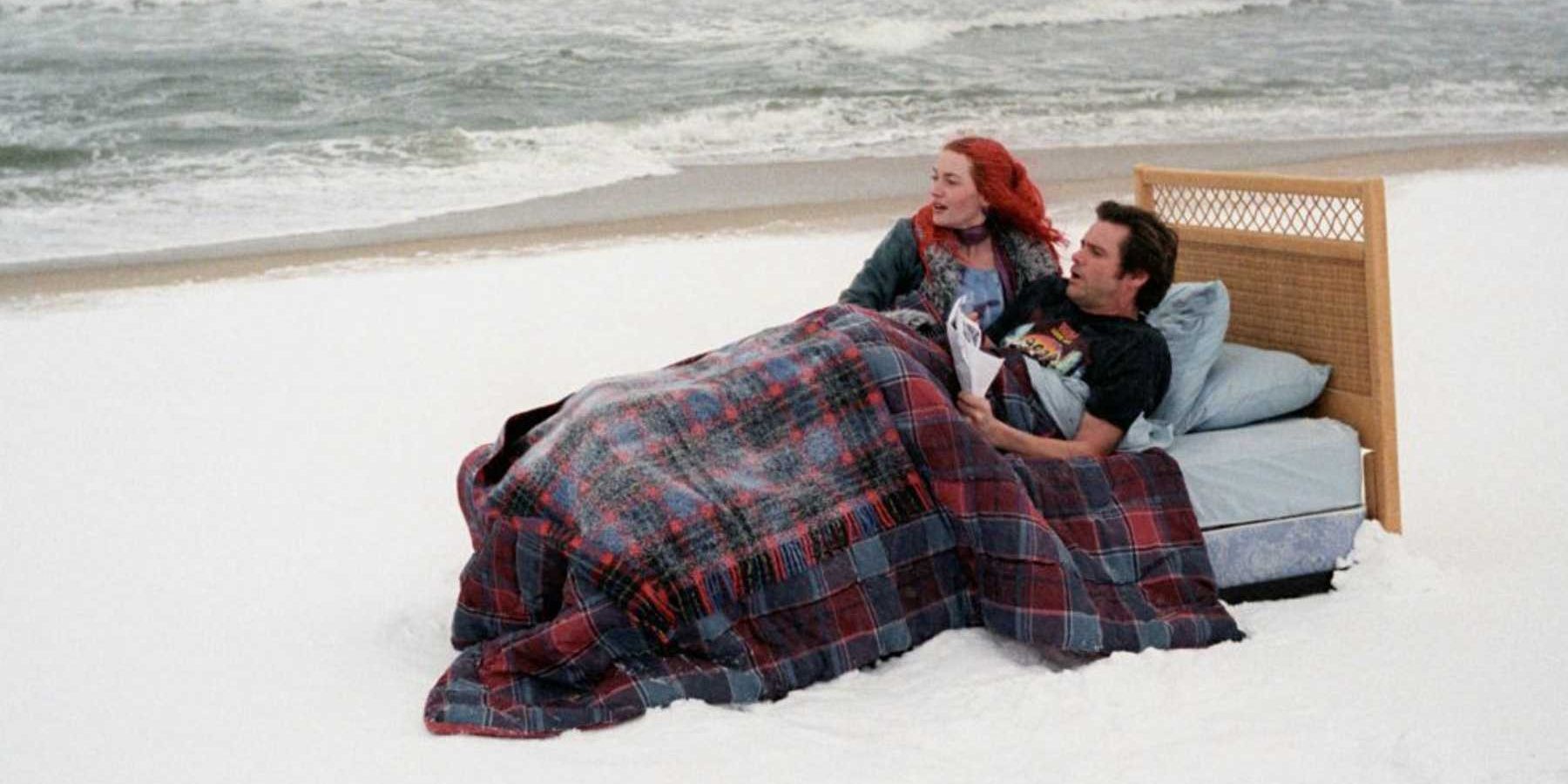 Kate Winslet and Jim Carrey on a bed on a beach in Eternal Sunshine of the Spotless Mind (2004)