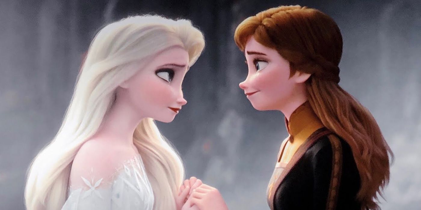 Elsa and Anna hold hands as they talk in Frozen 2