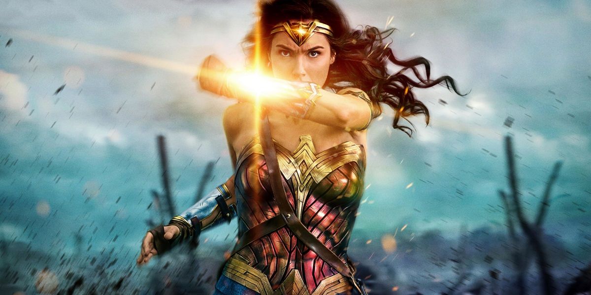 Wonder Woman blocks a bullet wth her forearm bracelets