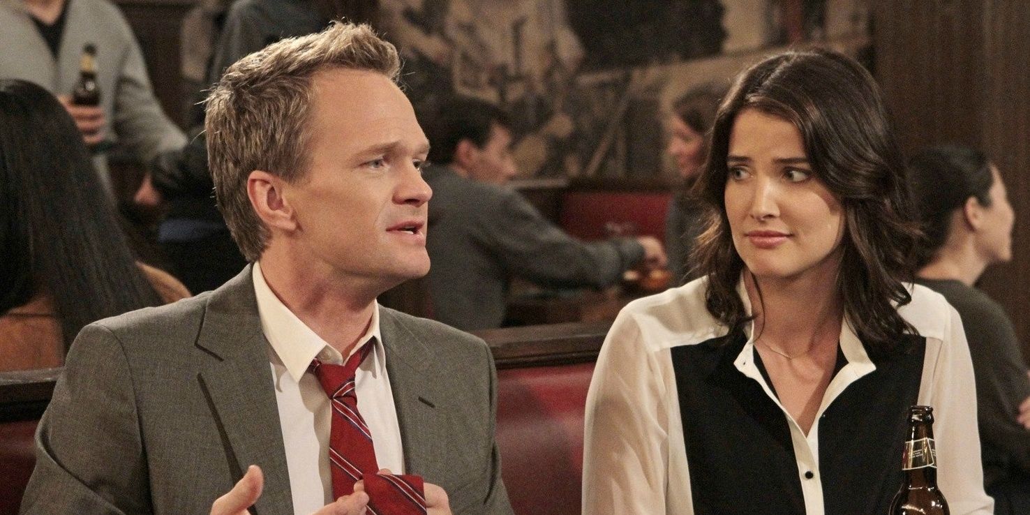 Robin and Barney sitting next to each other in How I Met Your Mother.