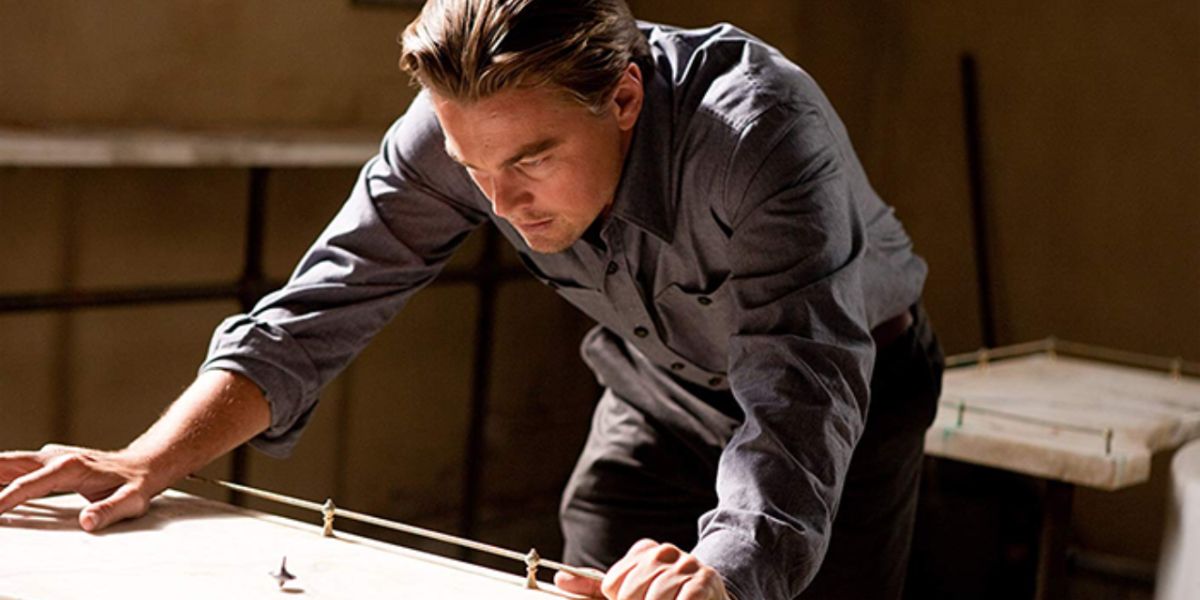 Leonardo DiCaprio watches a top spin from Inception 