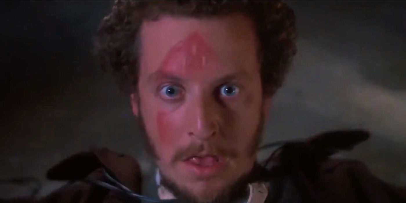 Marv looking at the camera with a clothing iron imprint in his face in Home Alone (1990)