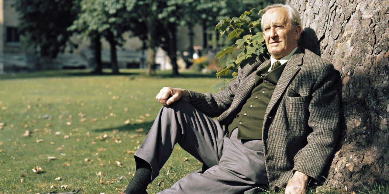 JRR Tolkien leaning against a tree