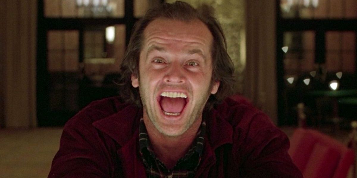 Jack Torrance laughing in a bar in The Shining