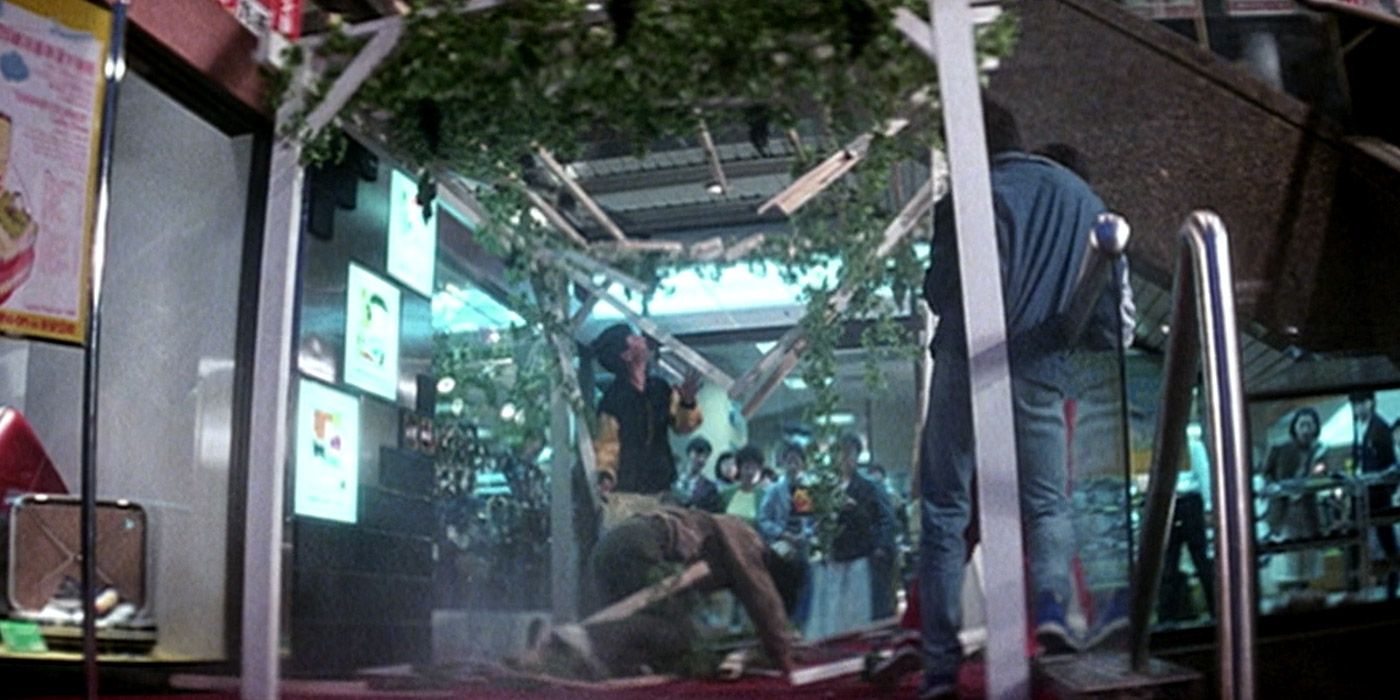 Jackie Chan gets up after falling through a trellis in Police Story