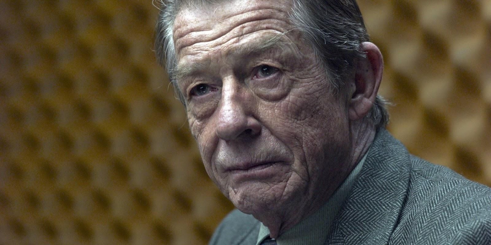 Contact (John Hurt) smiling in Tinker Tailor Soldier Spy