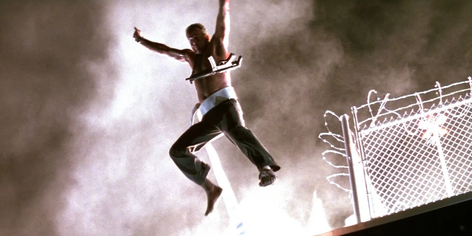 John McClane jumps off the roof in Die Hard