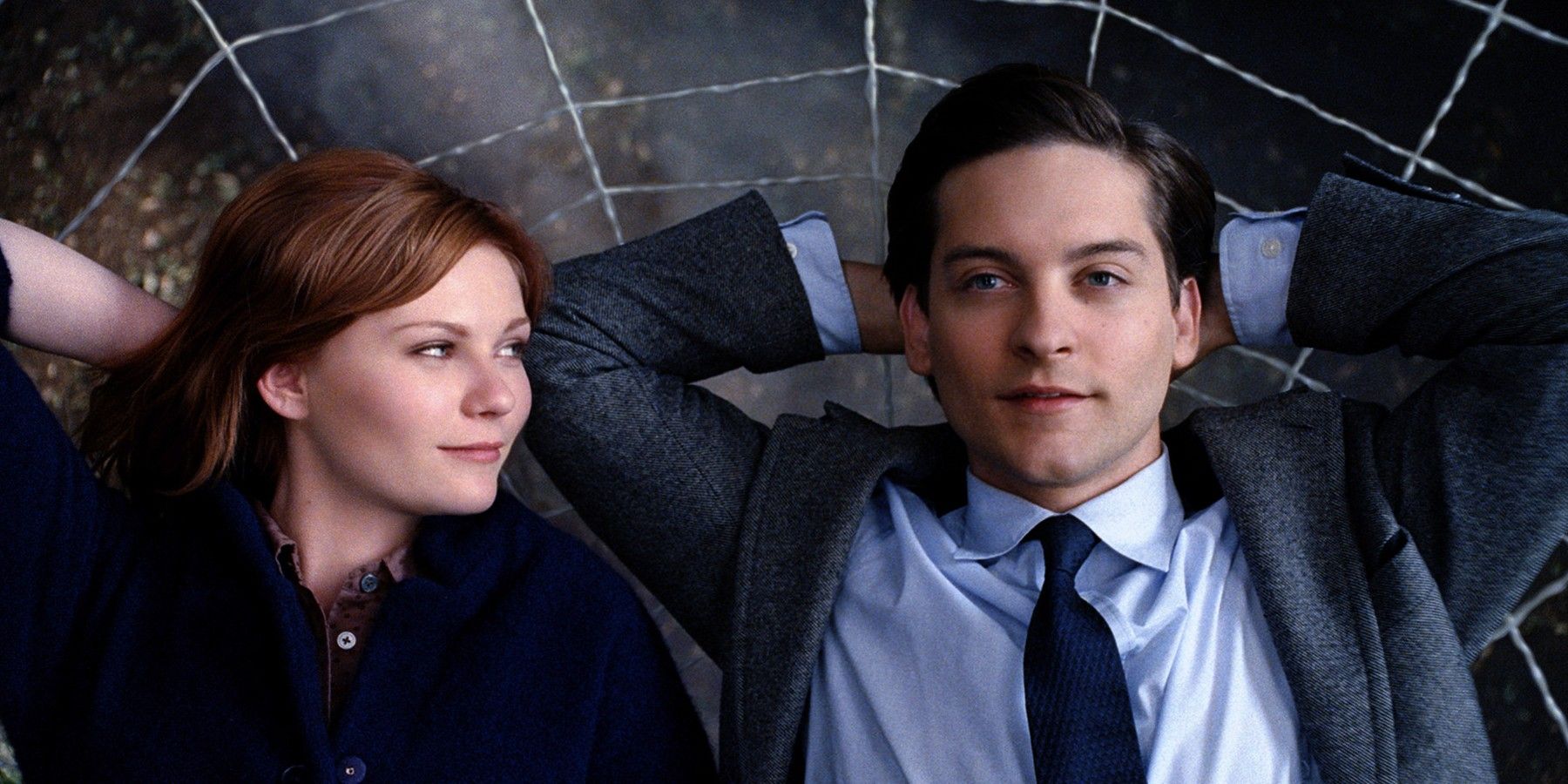 Kirsten Dunst and Tobey Maguire lying in a web in Spider-Man 3