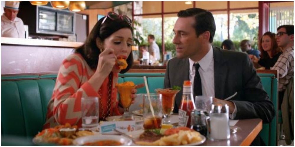 Megan and Don eating in a restaurant on Mad Men