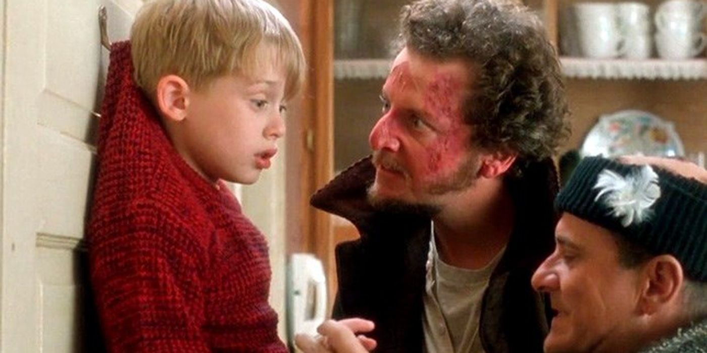 Marv and Harry pin Kevin against a wall in Home Alone