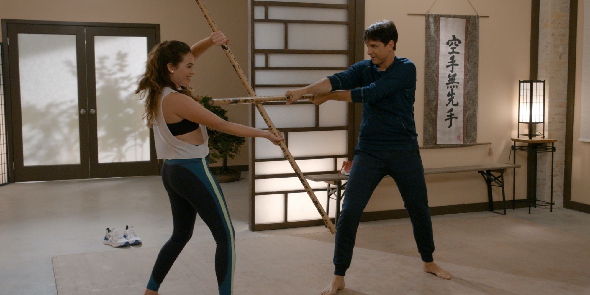 Mary Mouser and Ralph Macchio in Cobra Kai