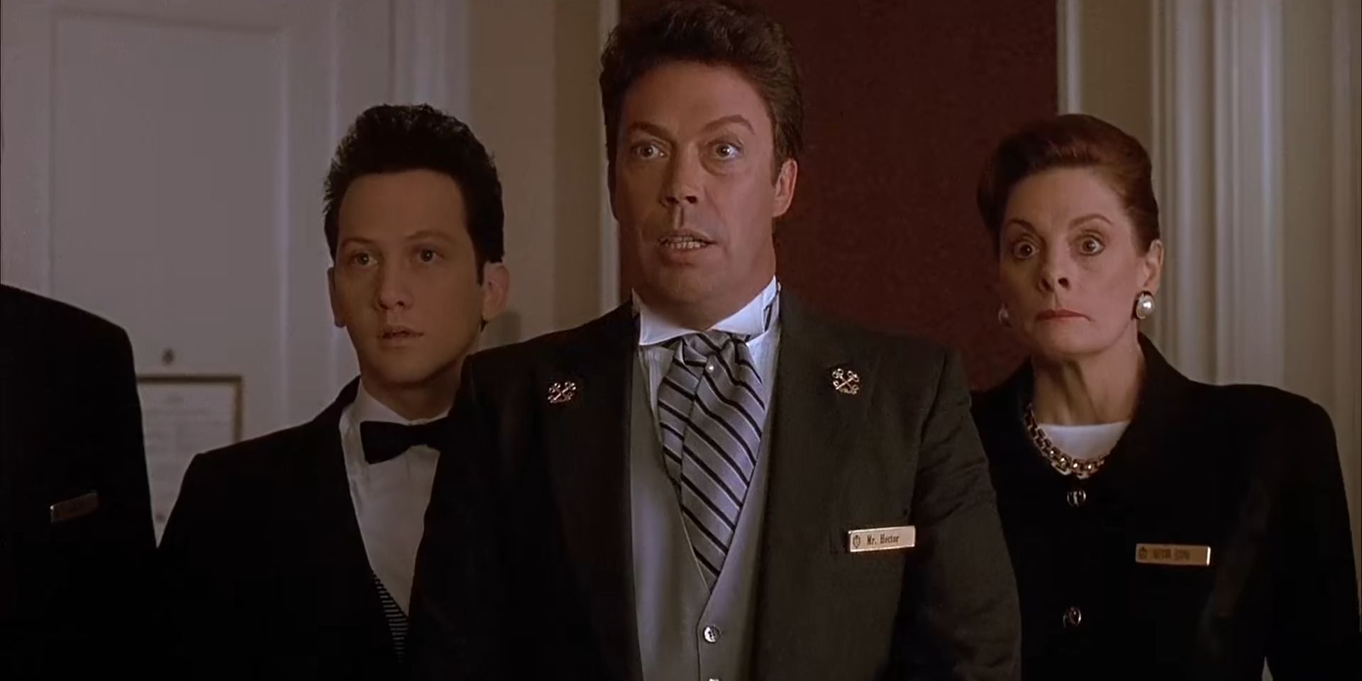 Tim Curry as the Concierge with the staff inside Kevin's room in Home Alone 2: Lost In New York (1991)