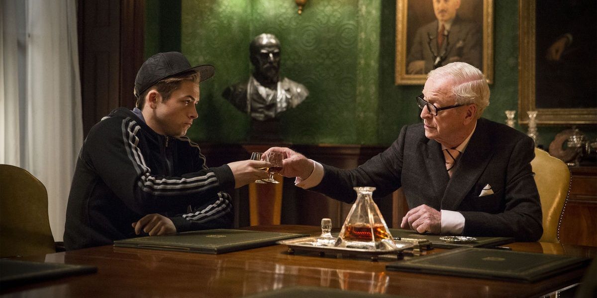 Eggsy and Arthur have a drink together in Kingsman