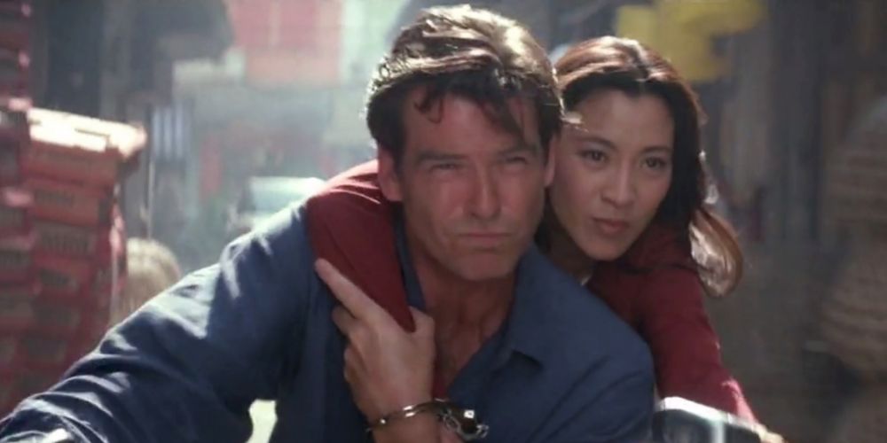 Michelle Yeoh as Wai Lin riding a motorcycle with James Bond in Tomorrow Never Dies