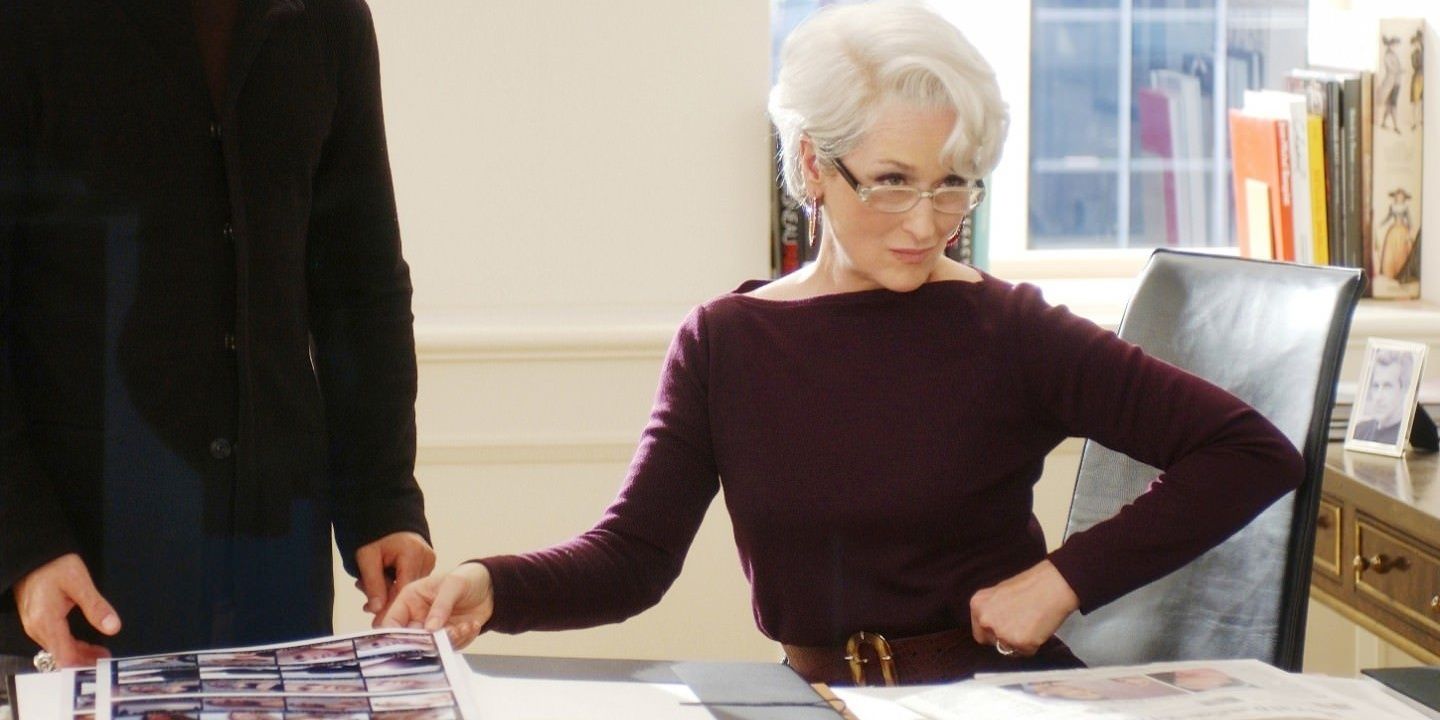 Meryl Streep as Miranda Priestly peering over her glasses at her assistant in The Devil Wears Prada.