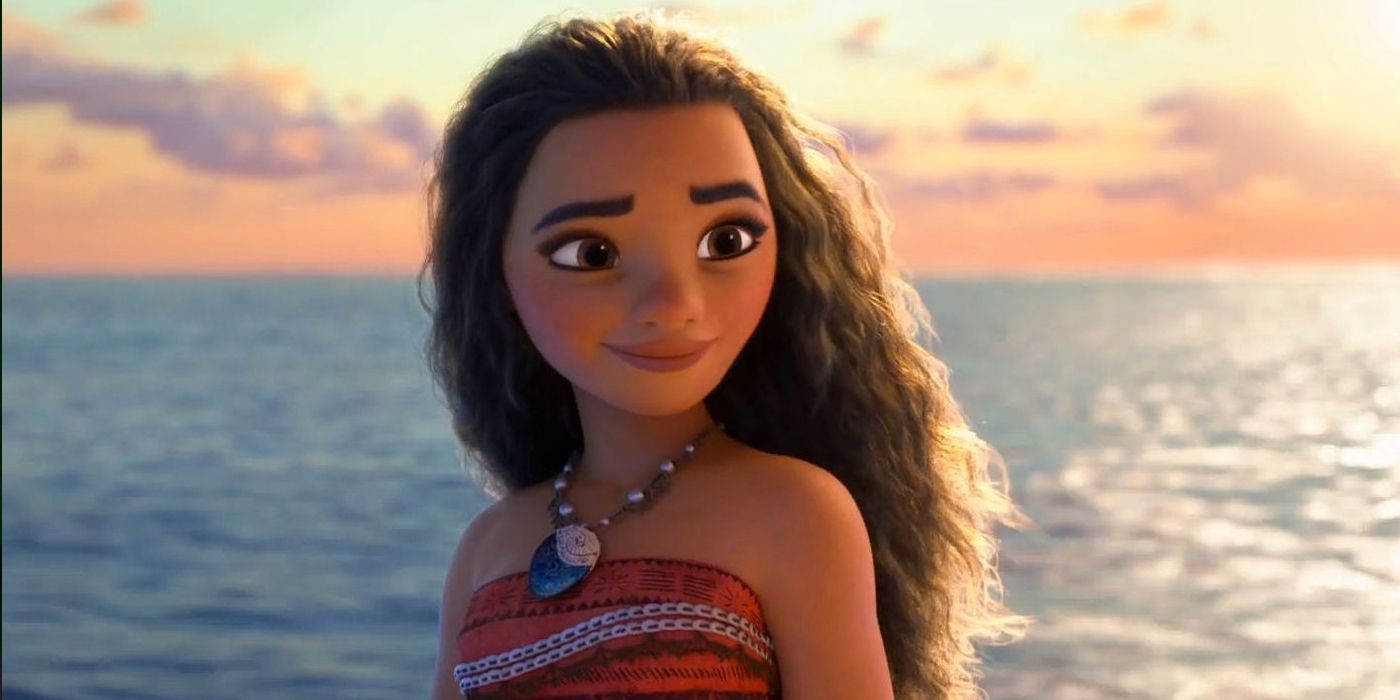Disney's Moana standing in front of the ocean.