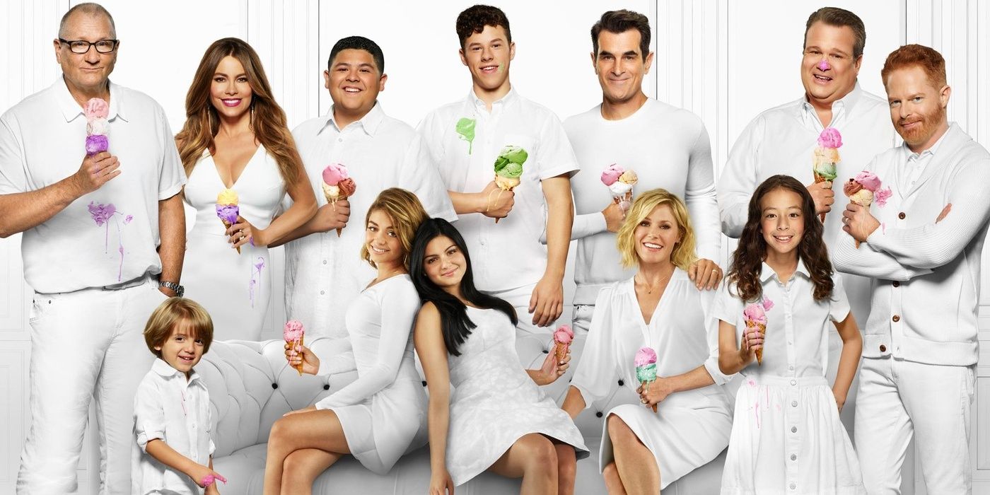 The cast of Modern Family all dressed in white and holding ice cream cones