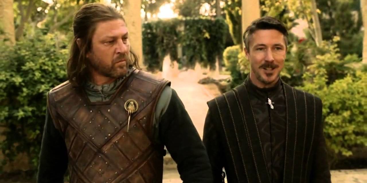 Ned Stark and Littlefinger walk together in King's Landing in Game of Thrones