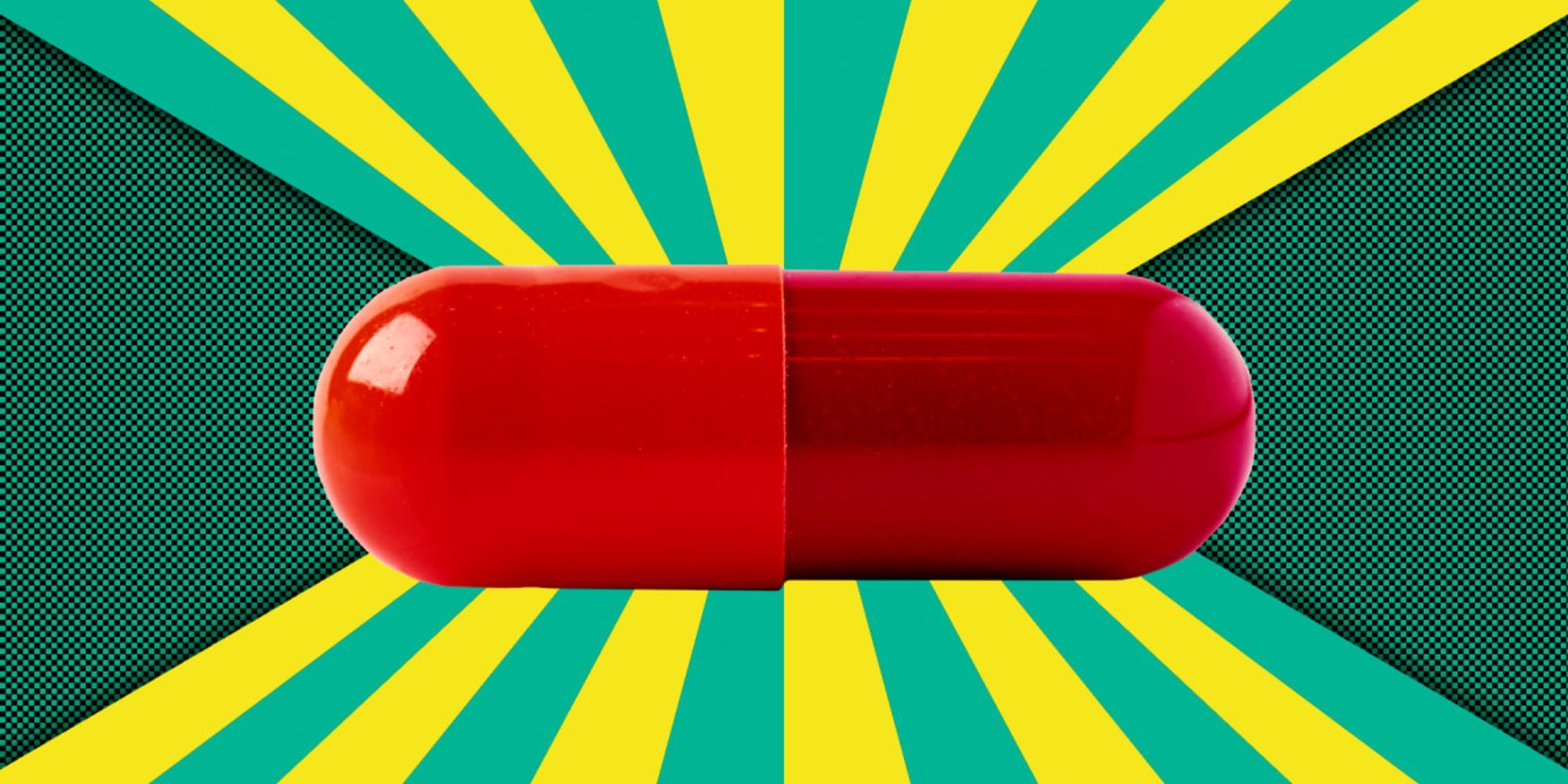 A red pill on a green and yellow background. 