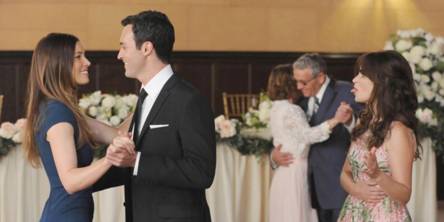 Jess watches while Ted dances with someone else in New Girl Last Wedding