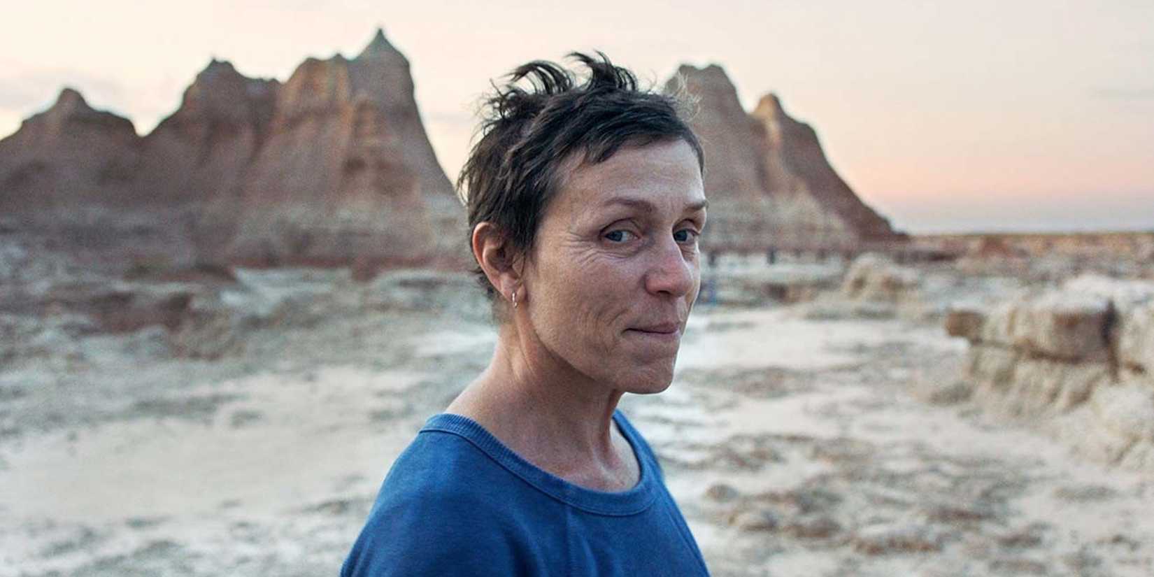 Frances McDormand as Fern smiles in Nomadland.