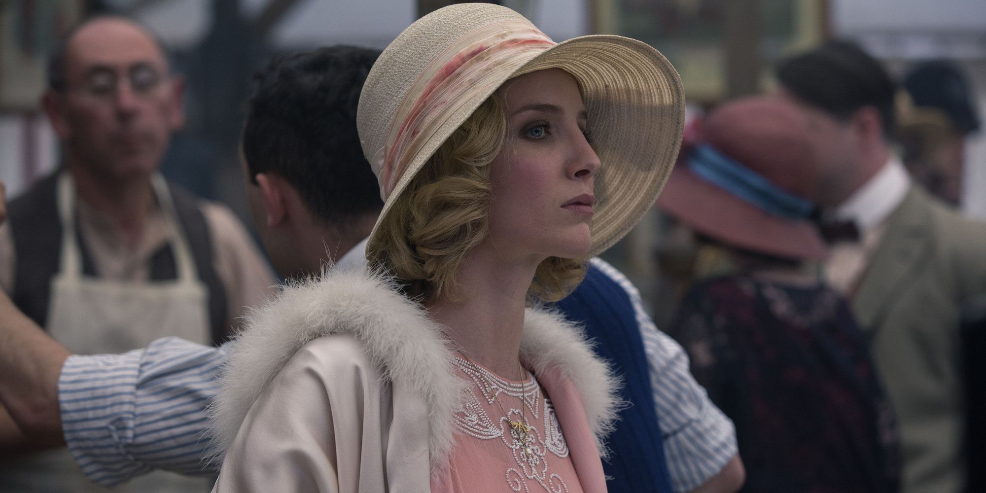 Grace Shelby in a hat looking into the crowd in Peaky Blinders