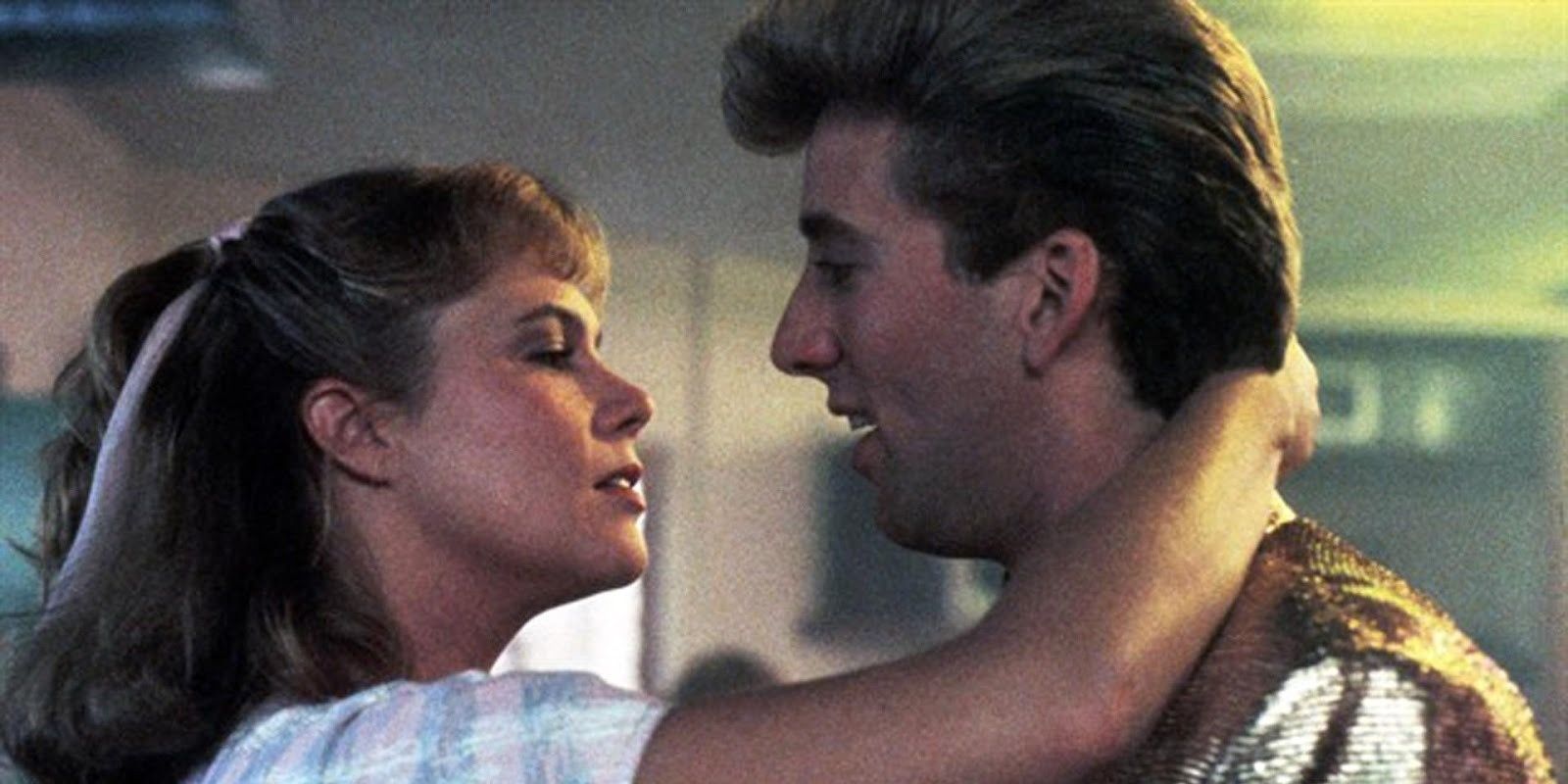 Kathleen Turner going into kiss Nicolas Cage in Peggy Sue Got Married