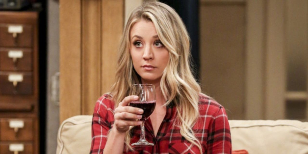 Penny Drinking wine in her living room on TBBT